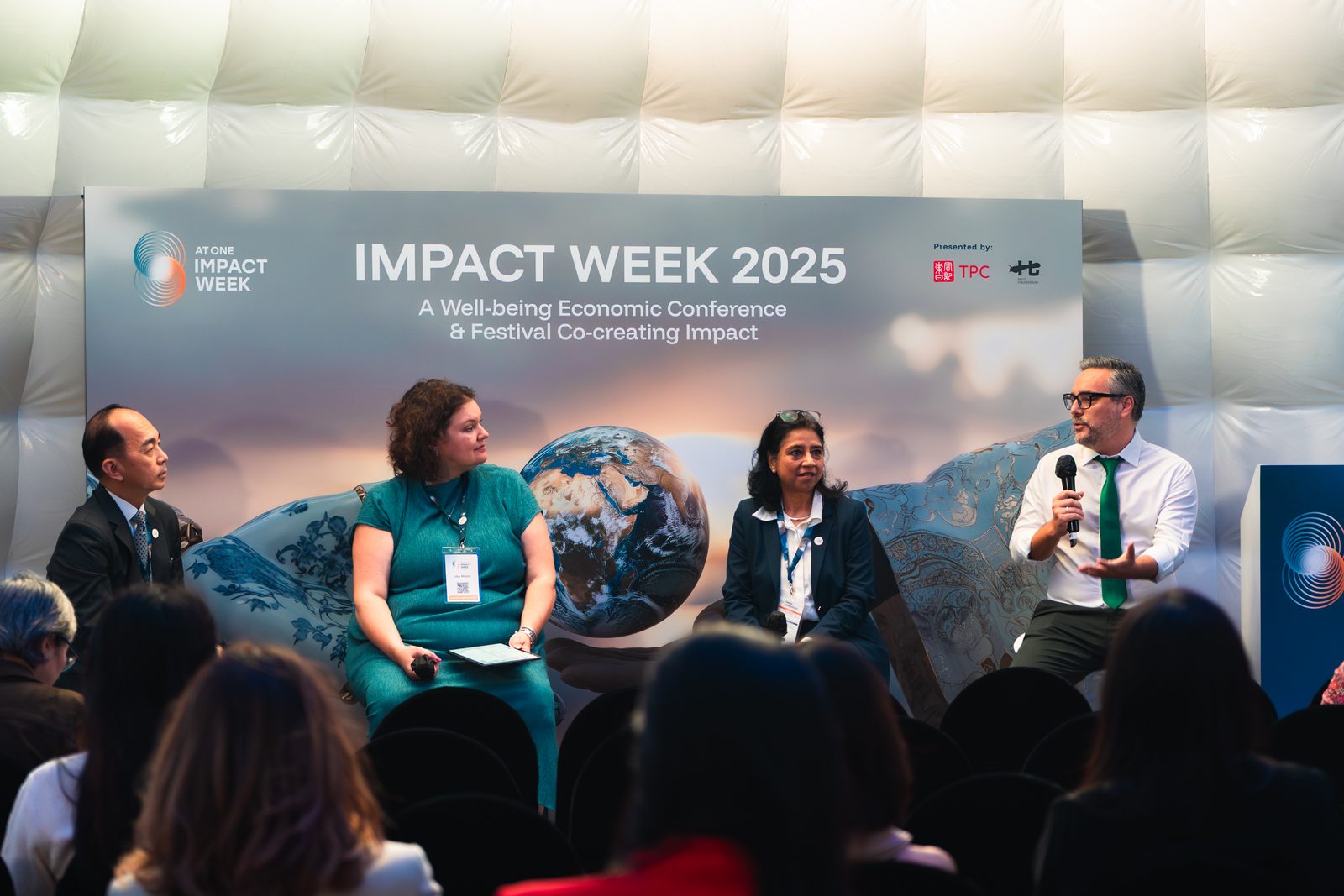 Panel discussion on stage at Impact Week 2025