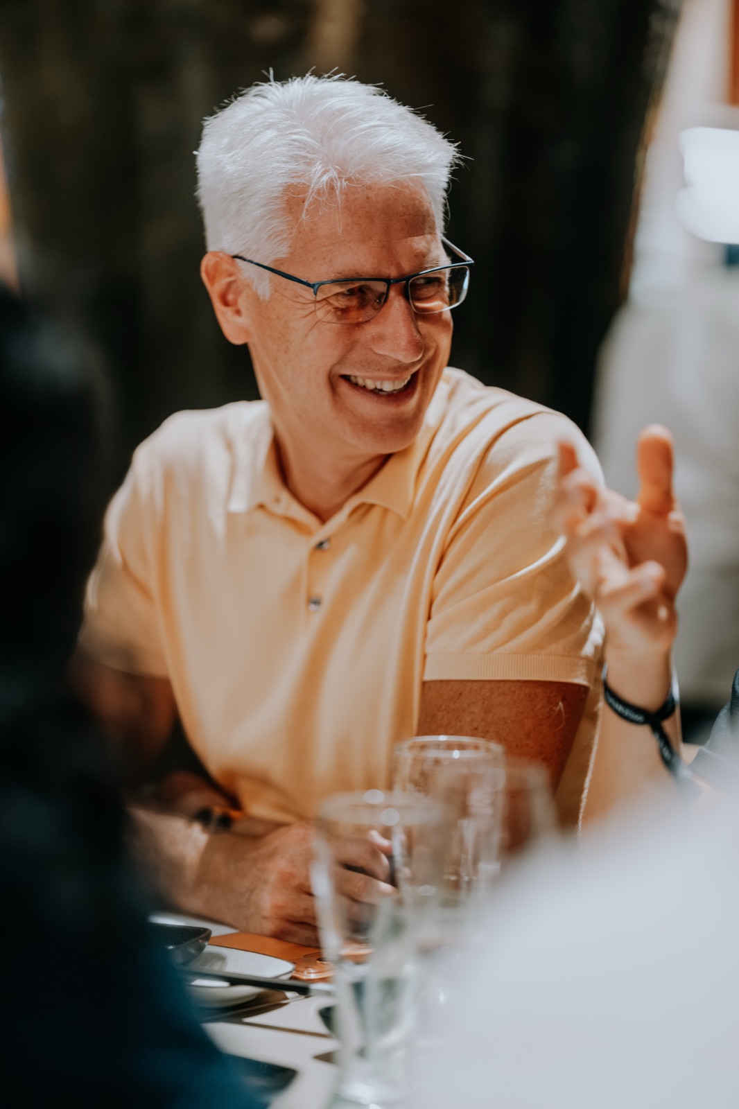 Guest laughing at the Mercuryo team dinner